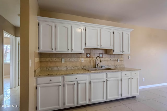 3303 Ward Robert Pl, El Paso, TX 79936 - kitchen featuring a sink, light tile patterned floors, and white cabinets