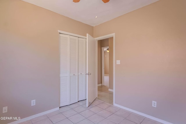 3303 Ward Robert Pl, El Paso, TX 79936 - unfurnished bedroom with a closet, light tile patterned floors, baseboards, and ceiling fan
