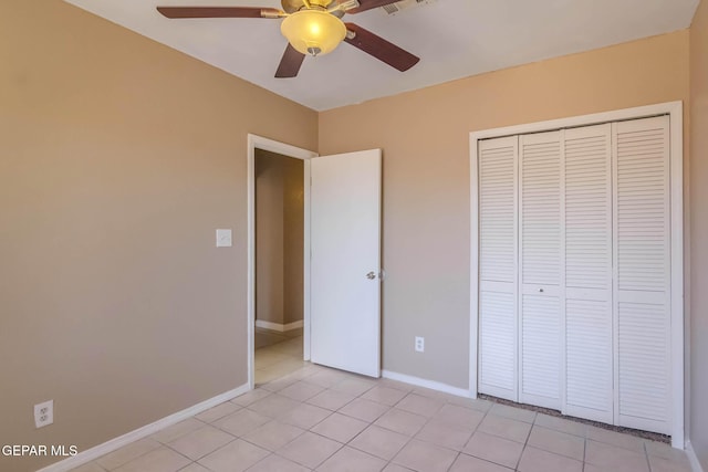 3303 Ward Robert Pl, El Paso, TX 79936 - unfurnished bedroom featuring light tile patterned flooring, a closet, baseboards, and ceiling fan