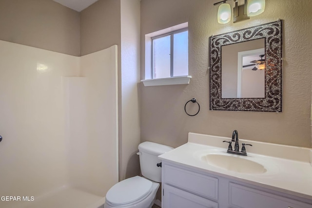 3303 Ward Robert Pl, El Paso, TX 79936 - bathroom featuring a shower, vanity, toilet, and a textured wall