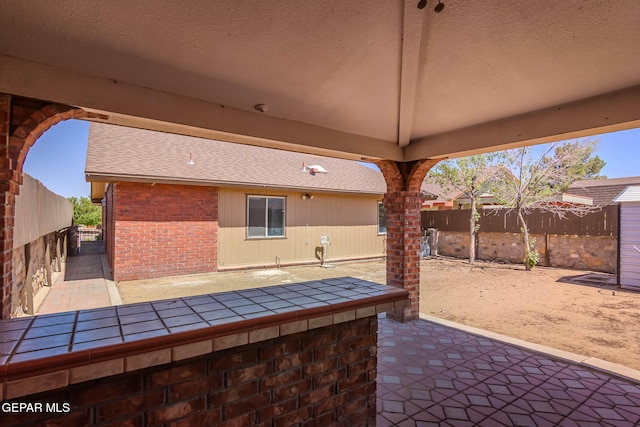 3303 Ward Robert Pl, El Paso, TX 79936 - fenced backyard featuring a patio area