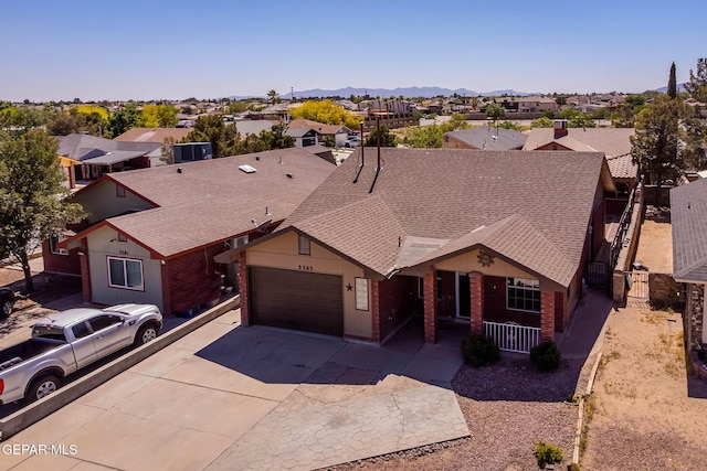 3303 Ward Robert Pl, El Paso, TX 79936 - view of front of home with a residential view, a garage, concrete driveway, and roof with shingles
