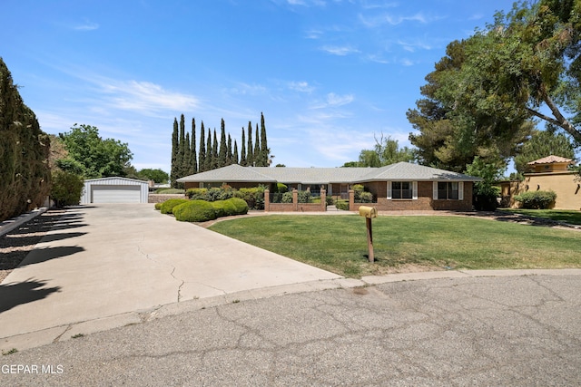 5445 Connors Ln, El Paso, TX 79932 - ranch-style home with a detached garage, a front yard, and an outbuilding