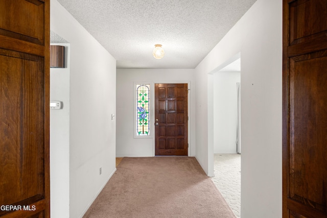 5445 Connors Ln, El Paso, TX 79932 - entryway featuring light colored carpet and a textured ceiling
