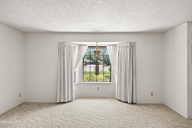 5445 Connors Ln, El Paso, TX 79932 - carpeted spare room featuring a textured ceiling and baseboards