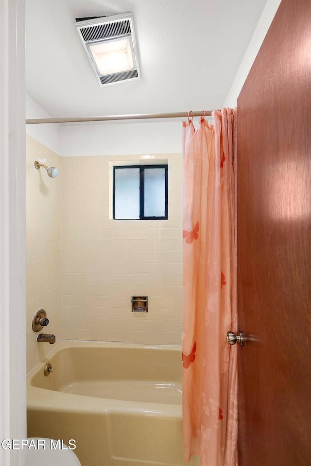 5445 Connors Ln, El Paso, TX 79932 - bathroom featuring shower / bath combination with curtain