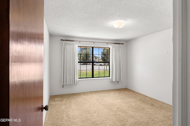 5445 Connors Ln, El Paso, TX 79932 - carpeted empty room featuring a textured ceiling