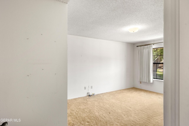 5445 Connors Ln, El Paso, TX 79932 - carpeted empty room with a textured ceiling and baseboards
