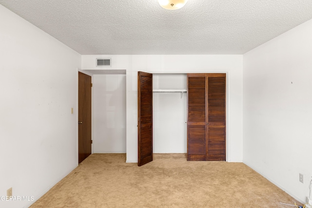 5445 Connors Ln, El Paso, TX 79932 - unfurnished bedroom featuring carpet flooring, a closet, and a textured ceiling
