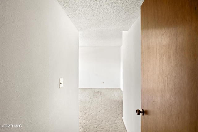 5445 Connors Ln, El Paso, TX 79932 - corridor featuring a textured ceiling and carpet