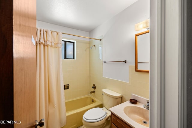 5445 Connors Ln, El Paso, TX 79932 - full bathroom with toilet, vanity, shower / bath combination with curtain, and tile walls