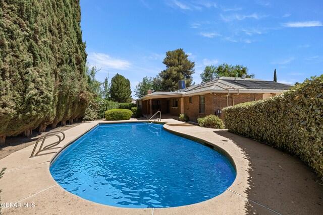 5445 Connors Ln, El Paso, TX 79932 - swimming pool with a patio and central AC