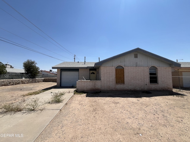 736 Jamestown Rd, El Paso, TX 79907 - ranch-style house with brick siding, a garage, and driveway