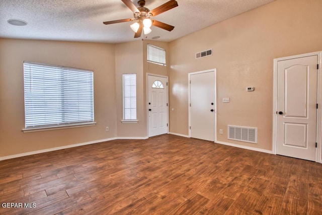 11924 Mesquite Rock Dr, El Paso, TX 79934 - entrance foyer with a ceiling fan, plenty of natural light, wood finished floors, a textured ceiling, and baseboards