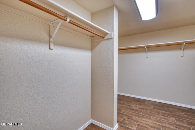 11924 Mesquite Rock Dr, El Paso, TX 79934 - walk in closet featuring wood finished floors