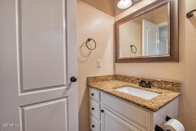 11924 Mesquite Rock Dr, El Paso, TX 79934 - bathroom featuring vanity and a textured wall