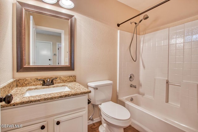 11924 Mesquite Rock Dr, El Paso, TX 79934 - bathroom featuring toilet, shower / washtub combination, a textured wall, and vanity