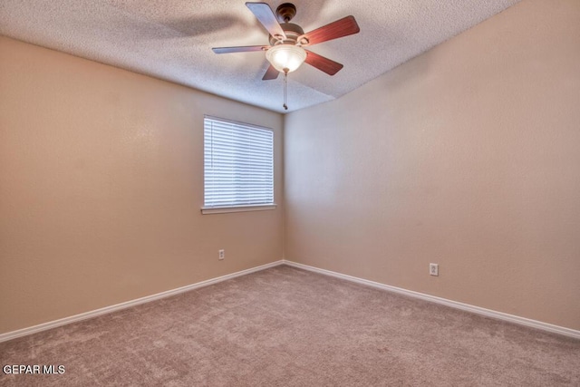 11924 Mesquite Rock Dr, El Paso, TX 79934 - spare room with carpet, ceiling fan, baseboards, and a textured ceiling