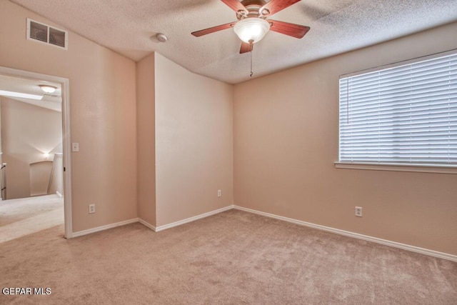 11924 Mesquite Rock Dr, El Paso, TX 79934 - spare room featuring carpet, a textured ceiling, a ceiling fan, and baseboards