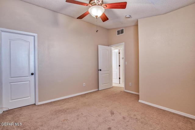 11924 Mesquite Rock Dr, El Paso, TX 79934 - unfurnished bedroom with carpet floors, baseboards, a ceiling fan, and a textured ceiling
