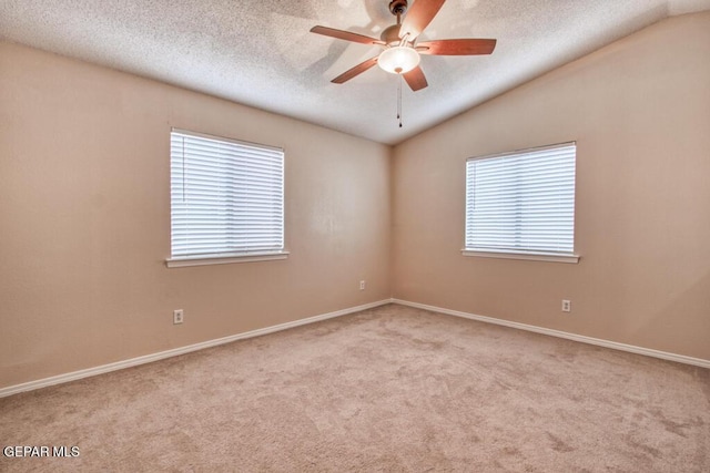 11924 Mesquite Rock Dr, El Paso, TX 79934 - carpeted empty room featuring lofted ceiling, a textured ceiling, baseboards, and a ceiling fan