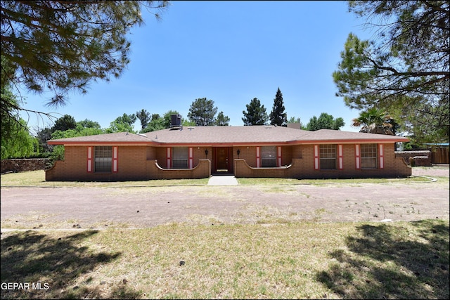 312 Caporal Ct, El Paso, TX 79932 - rear view of house featuring a yard, brick siding, and a chimney