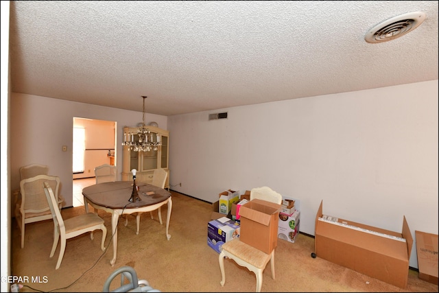 312 Caporal Ct, El Paso, TX 79932 - carpeted dining room featuring a chandelier and a textured ceiling