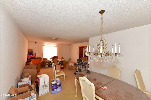 312 Caporal Ct, El Paso, TX 79932 - carpeted dining area with a textured ceiling and a chandelier