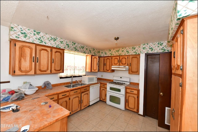 312 Caporal Ct, El Paso, TX 79932 - kitchen with white appliances, a sink, a textured ceiling, under cabinet range hood, and light countertops