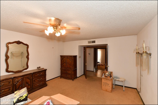 312 Caporal Ct, El Paso, TX 79932 - bedroom with light colored carpet, a textured ceiling, and ceiling fan