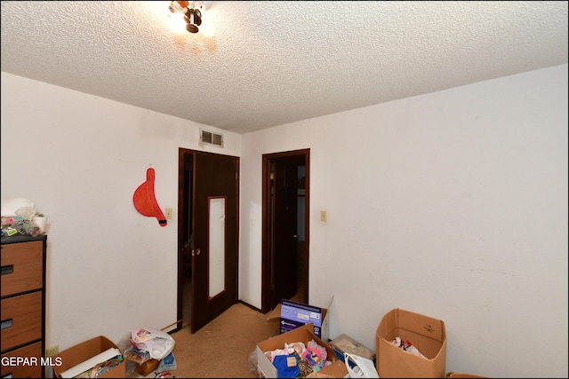 312 Caporal Ct, El Paso, TX 79932 - unfurnished bedroom with light carpet and a textured ceiling