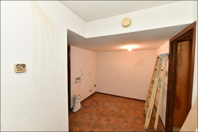 312 Caporal Ct, El Paso, TX 79932 - laundry room with a textured ceiling and washer hookup