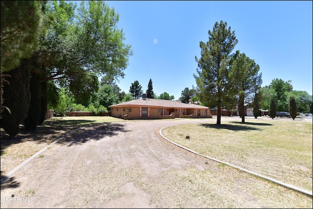 312 Caporal Ct, El Paso, TX 79932 - single story home featuring dirt driveway