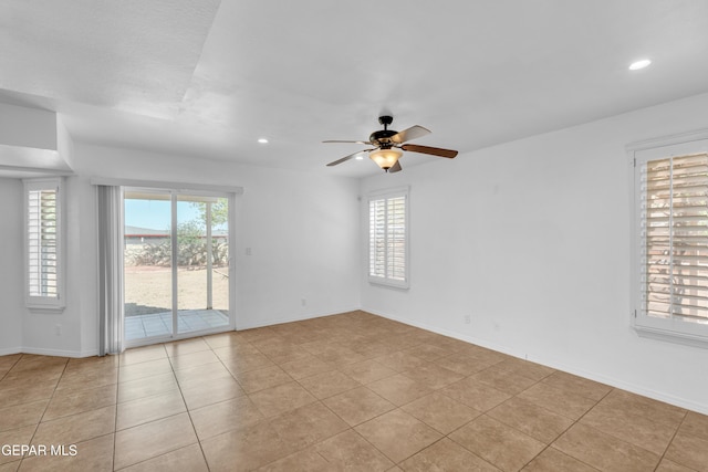 7461 Plaza Redonda Dr, El Paso, TX 79912 - unfurnished room featuring healthy amount of natural light, ceiling fan, recessed lighting, light tile patterned floors, and baseboards