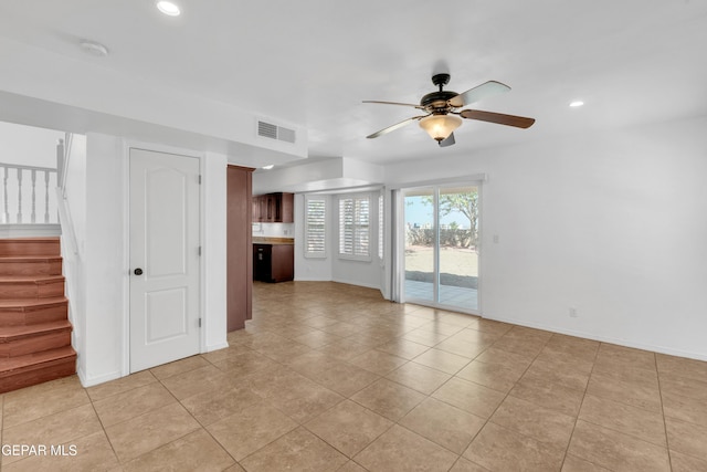7461 Plaza Redonda Dr, El Paso, TX 79912 - unfurnished living room featuring stairway, a ceiling fan, baseboards, recessed lighting, and light tile patterned floors