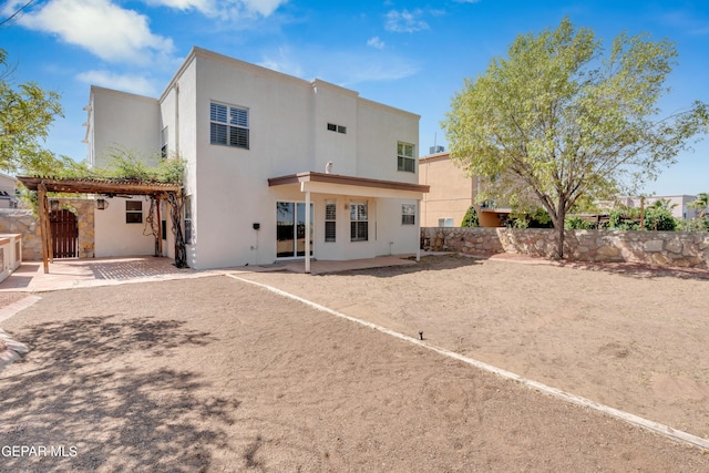 7461 Plaza Redonda Dr, El Paso, TX 79912 - rear view of property with a patio area, stucco siding, and a pergola