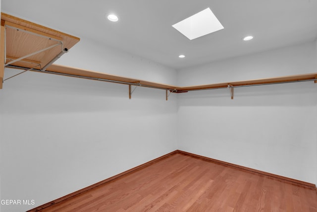 7461 Plaza Redonda Dr, El Paso, TX 79912 - spacious closet featuring a skylight and light wood-style flooring