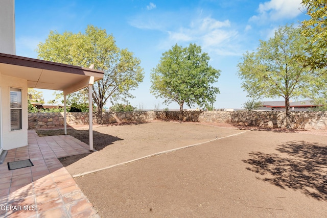 7461 Plaza Redonda Dr, El Paso, TX 79912 - fenced backyard with a patio