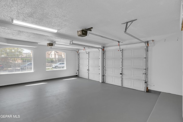 7461 Plaza Redonda Dr, El Paso, TX 79912 - garage featuring a garage door opener