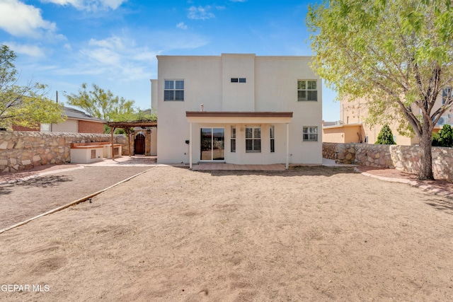 7461 Plaza Redonda Dr, El Paso, TX 79912 - rear view of house featuring a fenced backyard, a patio, a pergola, and stucco siding