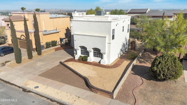 7461 Plaza Redonda Dr, El Paso, TX 79912 - view of front of house featuring central AC unit and stucco siding
