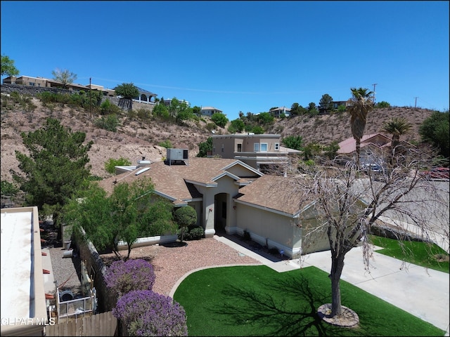 6609 El Poste Ct, El Paso, TX 79912 - view of front of property featuring cooling unit, roof with shingles, stucco siding, and concrete driveway