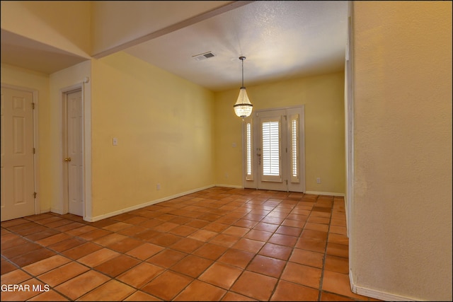 6609 El Poste Ct, El Paso, TX 79912 - unfurnished room featuring light tile patterned floors and baseboards