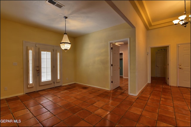 6609 El Poste Ct, El Paso, TX 79912 - tiled empty room with a chandelier and baseboards