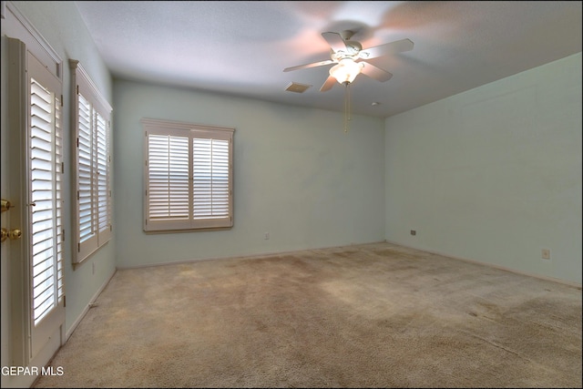 6609 El Poste Ct, El Paso, TX 79912 - spare room featuring plenty of natural light, carpet floors, and ceiling fan