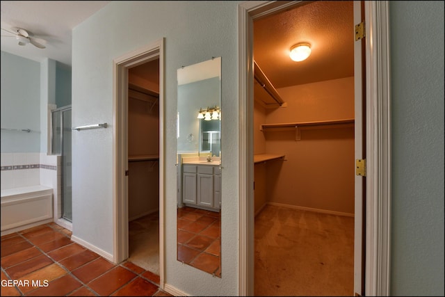 6609 El Poste Ct, El Paso, TX 79912 - walk in closet featuring a sink and tile patterned flooring