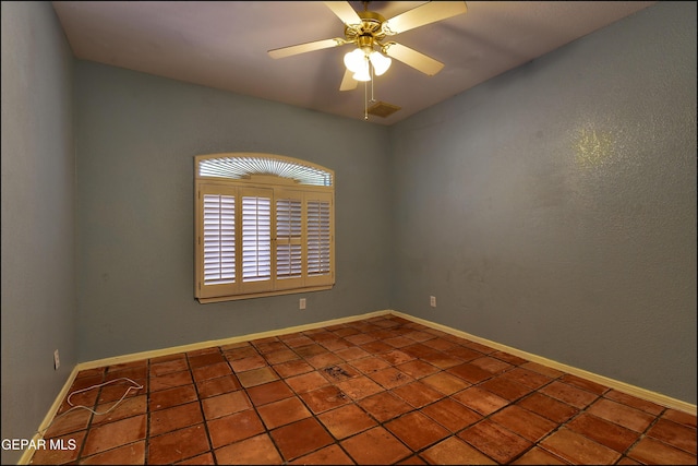 6609 El Poste Ct, El Paso, TX 79912 - tiled spare room featuring ceiling fan and baseboards