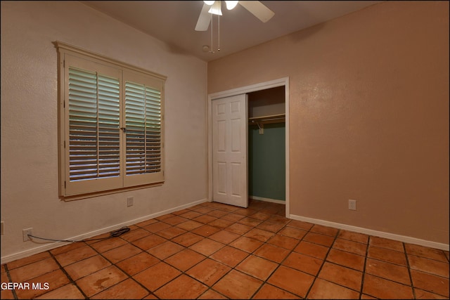 6609 El Poste Ct, El Paso, TX 79912 - unfurnished bedroom featuring light tile patterned floors, a closet, ceiling fan, and baseboards