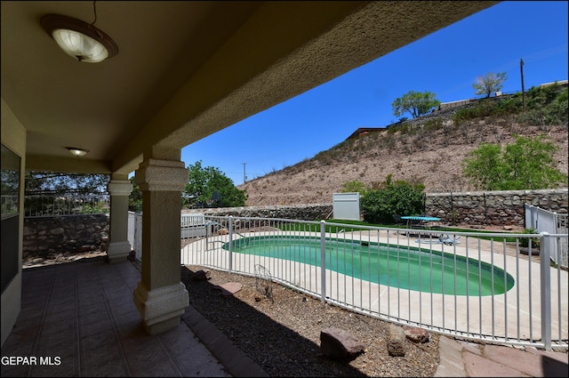 6609 El Poste Ct, El Paso, TX 79912 - view of pool featuring a patio area, a fenced backyard, and a mountain view