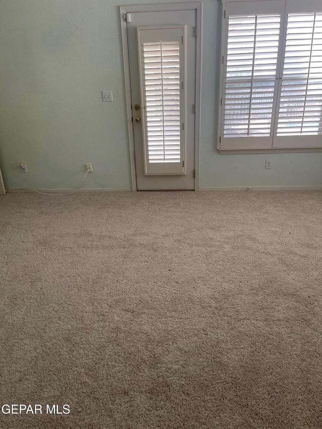 6609 El Poste Ct, El Paso, TX 79912 - unfurnished room with carpet flooring, plenty of natural light, and baseboards
